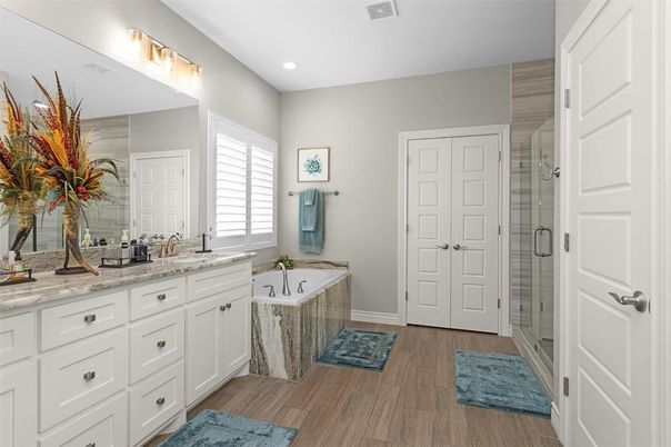 Bathroom, Dual Sink Vanities, Glass Shower, Interior, Recessed Lighting, Wood Texture Flooring