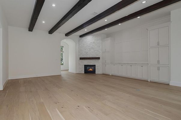 Empty room, Fireplace, Interior, Recessed Lighting, Stone Walls, Wooden Beams, Wood Texture Flooring