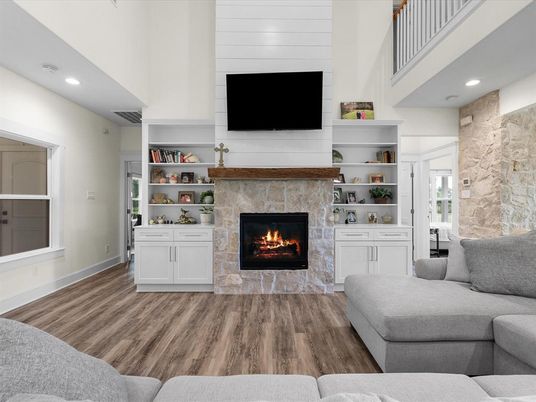 Fireplace, Interior, Living room, Recessed Lighting, Stone Walls, Wood Texture Flooring