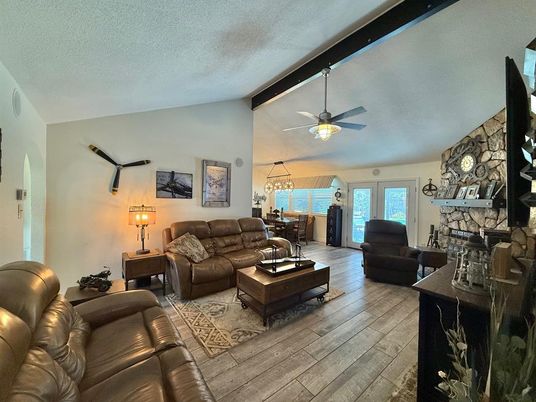 Dining room, Fireplace, Interior, Living room, Pendant Lights, Stone Walls, Wood Texture Flooring