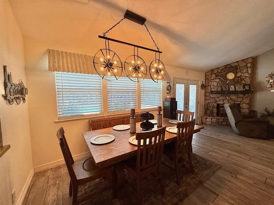 Dining room, Fireplace, Interior, Pendant Lights, Stone Walls, Wood Texture Flooring