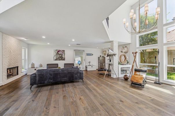 Fireplace, Interior, Living room, Recessed Lighting, Stone Walls, Wood Texture Flooring