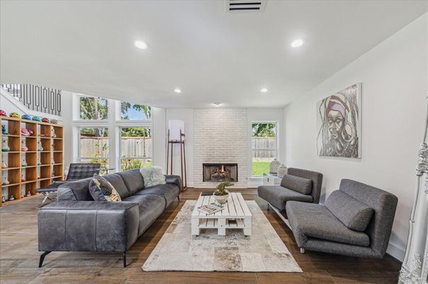 Fireplace, Interior, Living room, Recessed Lighting, Stone Walls, Wood Texture Flooring