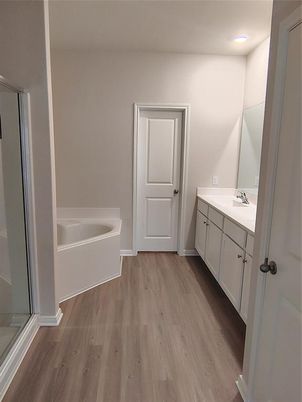 Bathroom, Dual Sink Vanities, Interior, Recessed Lighting, Wood Texture Flooring