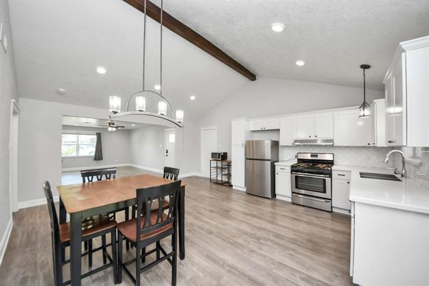 Dining room, Interior, Kitchen, Pendant Lights, Recessed Lighting, Stainless Steel Appliances, Wooden Beams, Wood Texture Flooring