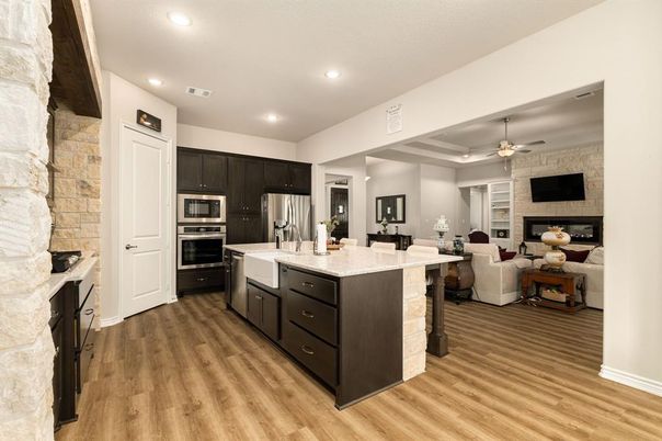 Interior, Kitchen, Living room, Recessed Lighting, Stainless Steel Appliances, Stone Walls, Wood Texture Flooring