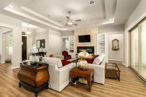 Fireplace, Interior, Living room, Pendant Lights, Recessed Lighting, Stone Walls, Wood Texture Flooring