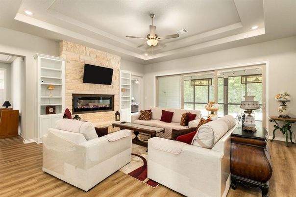 Fireplace, Interior, Living room, Recessed Lighting, Stone Walls, Wood Texture Flooring