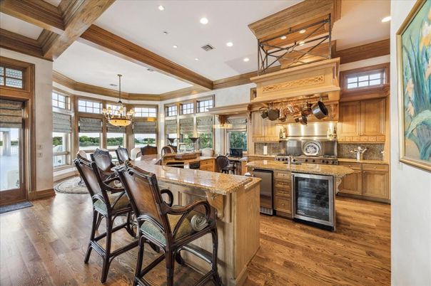 Chandelier, Dining room, Interior, Kitchen, Pendant Lights, Recessed Lighting, Stainless Steel Appliances, Wooden Beams, Wood Texture Flooring