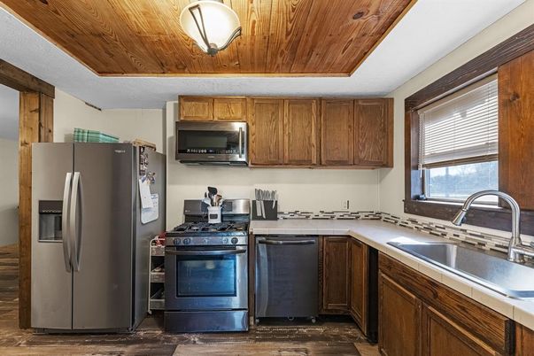 Interior, Kitchen, Tile Countertops, Wooden Ceilings, Wood Texture Flooring