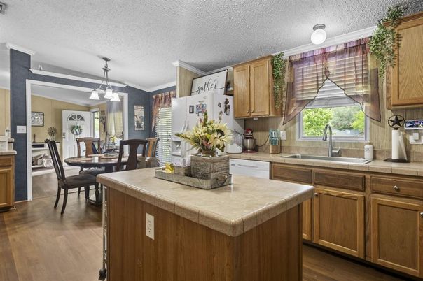 Dining room, Interior, Kitchen, Pendant Lights, Tile Countertops, Wood Texture Flooring