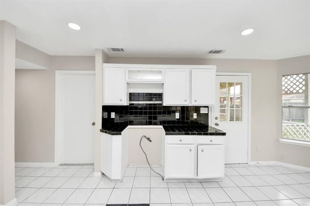 Interior, Kitchen, Recessed Lighting, Tile Countertops
