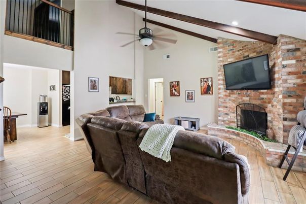 Fireplace, Interior, Living room, Recessed Lighting, Stone Walls, Wood Texture Flooring