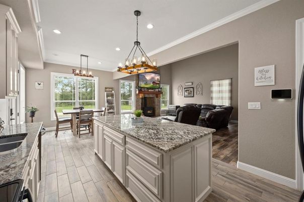 Chandelier, Dining room, Fireplace, Interior, Kitchen, Living room, Pendant Lights, Recessed Lighting, Wood Texture Flooring