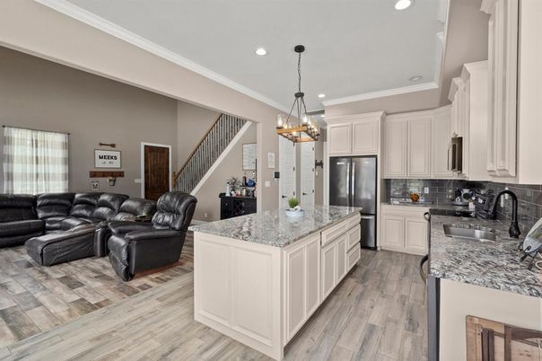 Chandelier, Interior, Kitchen, Living room, Pendant Lights, Recessed Lighting, Stainless Steel Appliances, Wood Texture Flooring