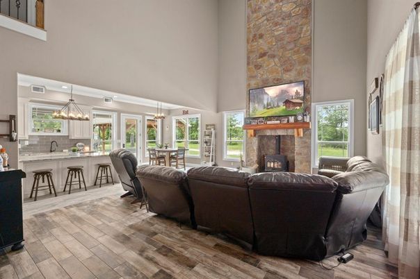 Dining room, Fireplace, Interior, Living room, Pendant Lights, Stone Walls, Wood Texture Flooring