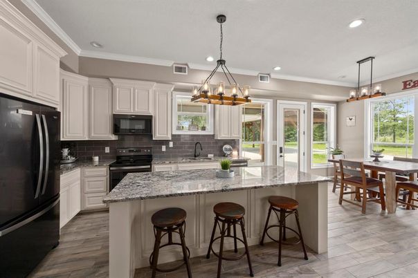 Chandelier, Dining room, Interior, Kitchen, Pendant Lights, Recessed Lighting, Stainless Steel Appliances, Wood Texture Flooring