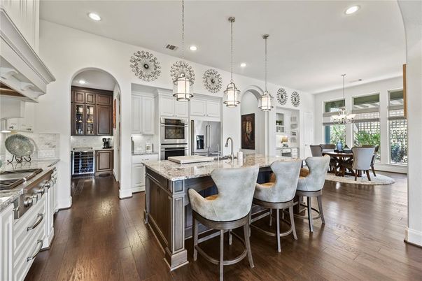 Chandelier, Dining room, Interior, Kitchen, Pendant Lights, Recessed Lighting, Stainless Steel Appliances, Wood Texture Flooring