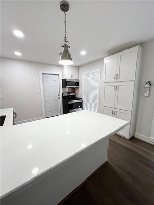 Interior, Kitchen, Pendant Lights, Recessed Lighting, Stainless Steel Appliances, Wood Texture Flooring
