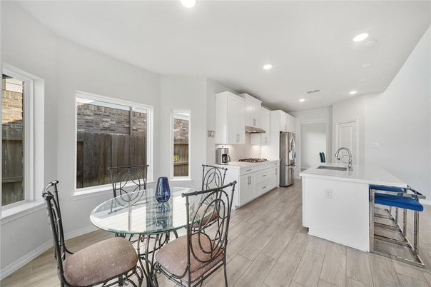 Dining room, Interior, Kitchen, Recessed Lighting, Stainless Steel Appliances, Wood Texture Flooring