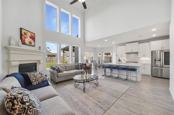 Fireplace, Interior, Kitchen, Living room, Recessed Lighting, Stainless Steel Appliances, Wood Texture Flooring