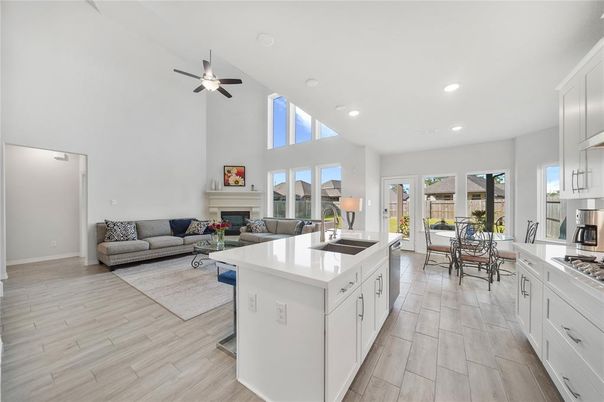 Dining room, Fireplace, Interior, Kitchen, Living room, Recessed Lighting, Wood Texture Flooring