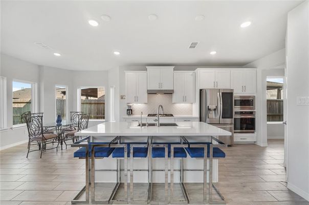 Dining room, Interior, Kitchen, Recessed Lighting, Stainless Steel Appliances, Wood Texture Flooring