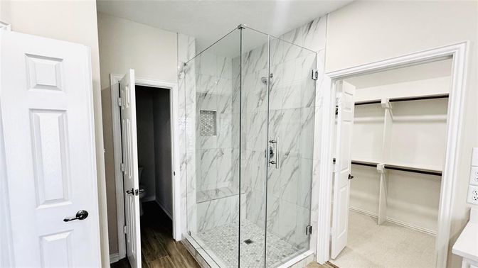 Bathroom, Glass Shower, Interior, Marble Walls, Wood Texture Flooring