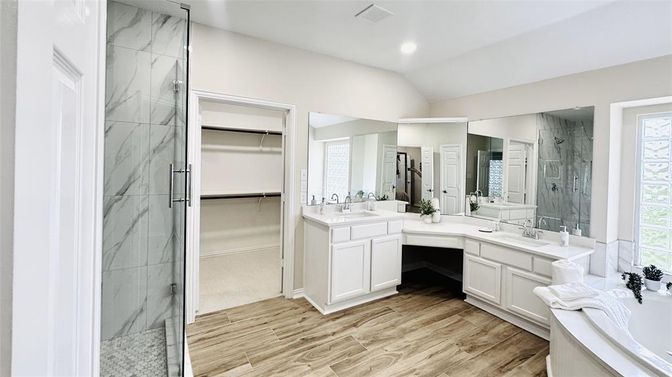 Bathroom, Dual Sink Vanities, Glass Shower, Interior, Marble Walls, Recessed Lighting, Walk-in Closets, Wood Texture Flooring