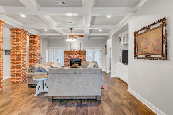 Fireplace, Interior, Living room, Recessed Lighting, Stone Walls, Wood Texture Flooring