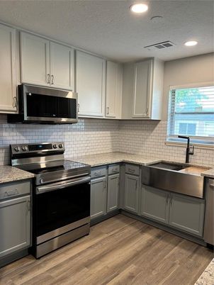 Interior, Kitchen, Recessed Lighting, Stainless Steel Appliances, Wood Texture Flooring