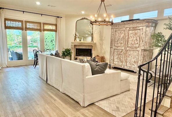 Chandelier, Fireplace, Interior, Living room, Pendant Lights, Recessed Lighting, Wood Texture Flooring