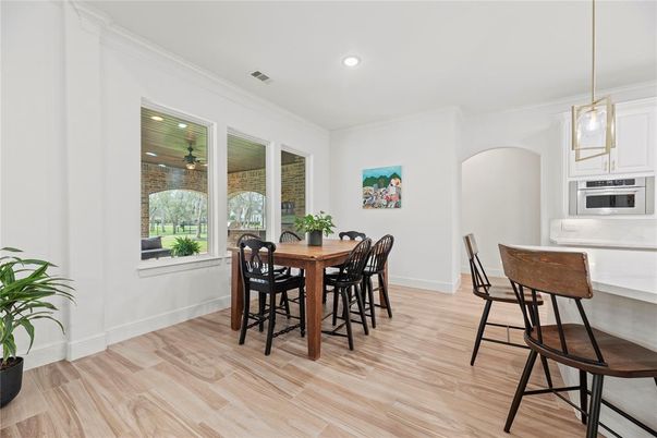 Dining room, Interior, Kitchen, Pendant Lights, Recessed Lighting, Stainless Steel Appliances, Wood Texture Flooring