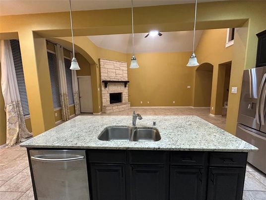 Fireplace, Interior, Kitchen, Pendant Lights, Stainless Steel Appliances, Stone Walls