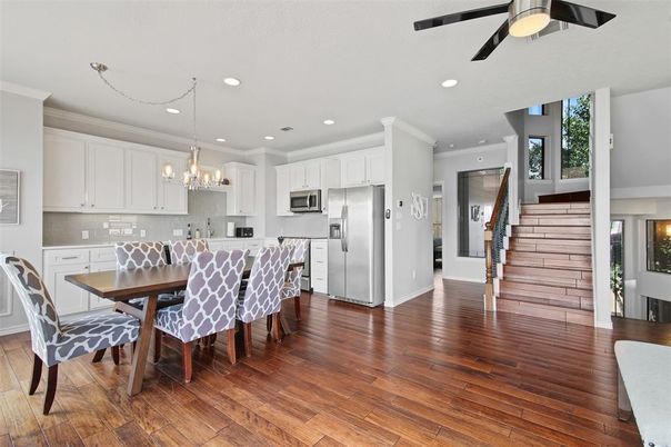 Chandelier, Dining room, Interior, Kitchen, Recessed Lighting, Stainless Steel Appliances, Wood Texture Flooring
