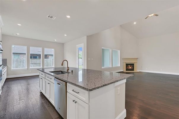Fireplace, Interior, Kitchen, Recessed Lighting, Stainless Steel Appliances, Wood Texture Flooring