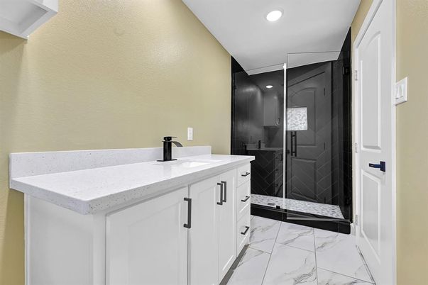 Bathroom, Dual Sink Vanities, Glass Shower, Interior, Marble, Recessed Lighting