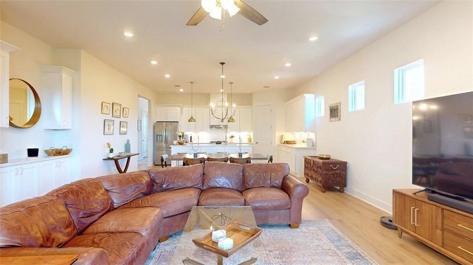 Chandelier, Dining room, Interior, Kitchen, Living room, Pendant Lights, Recessed Lighting, Stainless Steel Appliances, Wood Texture Flooring