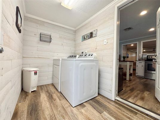 Interior, Recessed Lighting, Washer, Wood Texture Flooring, Wooden Walls