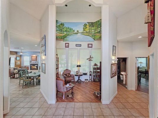 Dining room, Fireplace, Interior, Living room, Recessed Lighting, Wood Texture Flooring