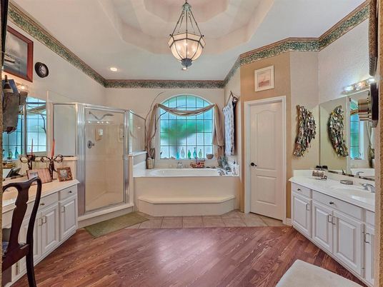 Bathroom, Dual Sink Vanities, Glass Shower, Interior, Pendant Lights, Recessed Lighting, Wood Texture Flooring