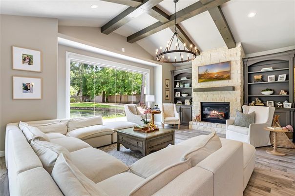 Chandelier, Fireplace, Interior, Living room, Pendant Lights, Recessed Lighting, Stone Walls, Wooden Beams, Wood Texture Flooring