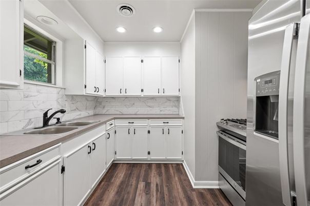 Interior, Kitchen, Marble Walls, Recessed Lighting, Stainless Steel Appliances, Wood Texture Flooring