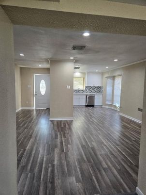 Empty room, Interior, Kitchen, Recessed Lighting, Stainless Steel Appliances, Wood Texture Flooring
