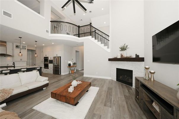 Fireplace, Interior, Kitchen, Living room, Pendant Lights, Recessed Lighting, Stainless Steel Appliances, Wood Texture Flooring