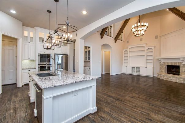 Chandelier, Fireplace, Interior, Kitchen, Pendant Lights, Recessed Lighting, Stainless Steel Appliances, Wood Texture Flooring