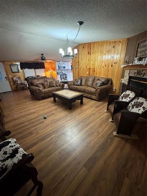 Chandelier, Fireplace, Interior, Living room, Wood Texture Flooring, Wooden Walls