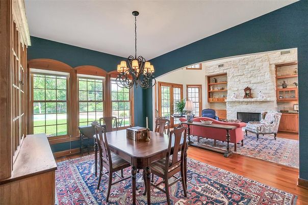 Chandelier, Dining room, Fireplace, Interior, Living room, Stone Walls, Wood Texture Flooring
