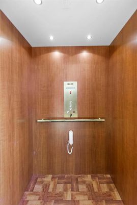 Elevator, Interior, Recessed Lighting, Wood Texture Flooring, Wooden Walls
