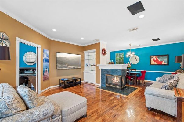 Dining room, Fireplace, Interior, Living room, Pendant Lights, Recessed Lighting, Wood Texture Flooring